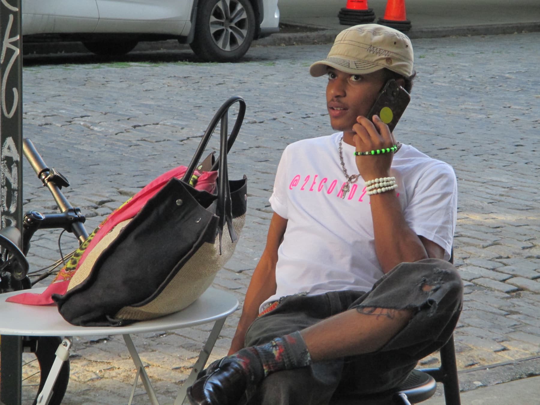 Model on a phone call on a Soho sidewalk
